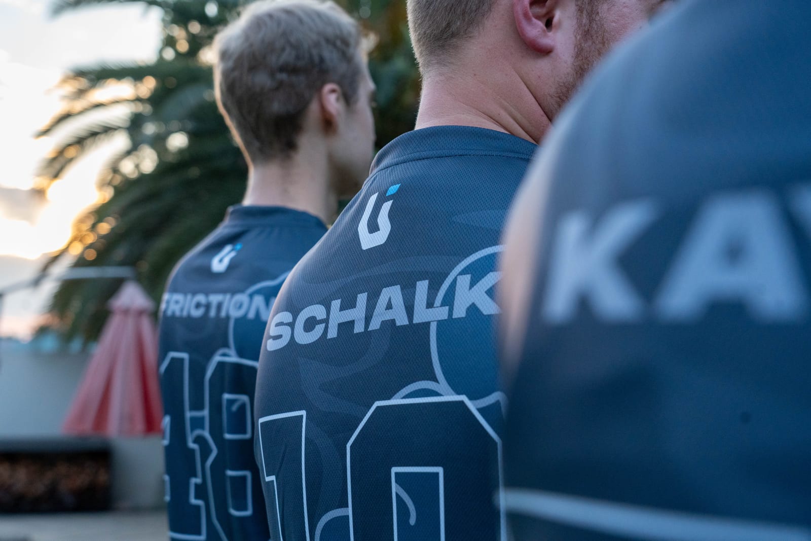 Team jerseys seen from behind, names and numbers in a row